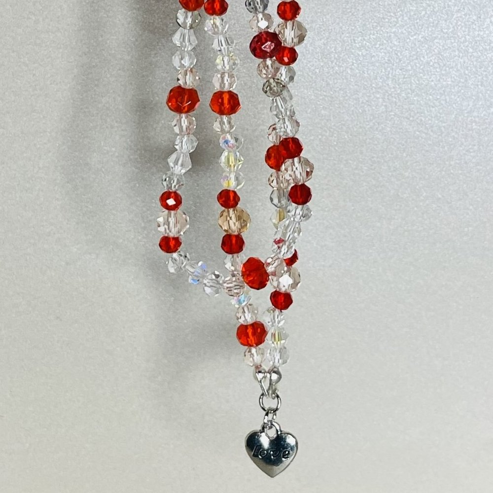 Beaded necklace with heart charm